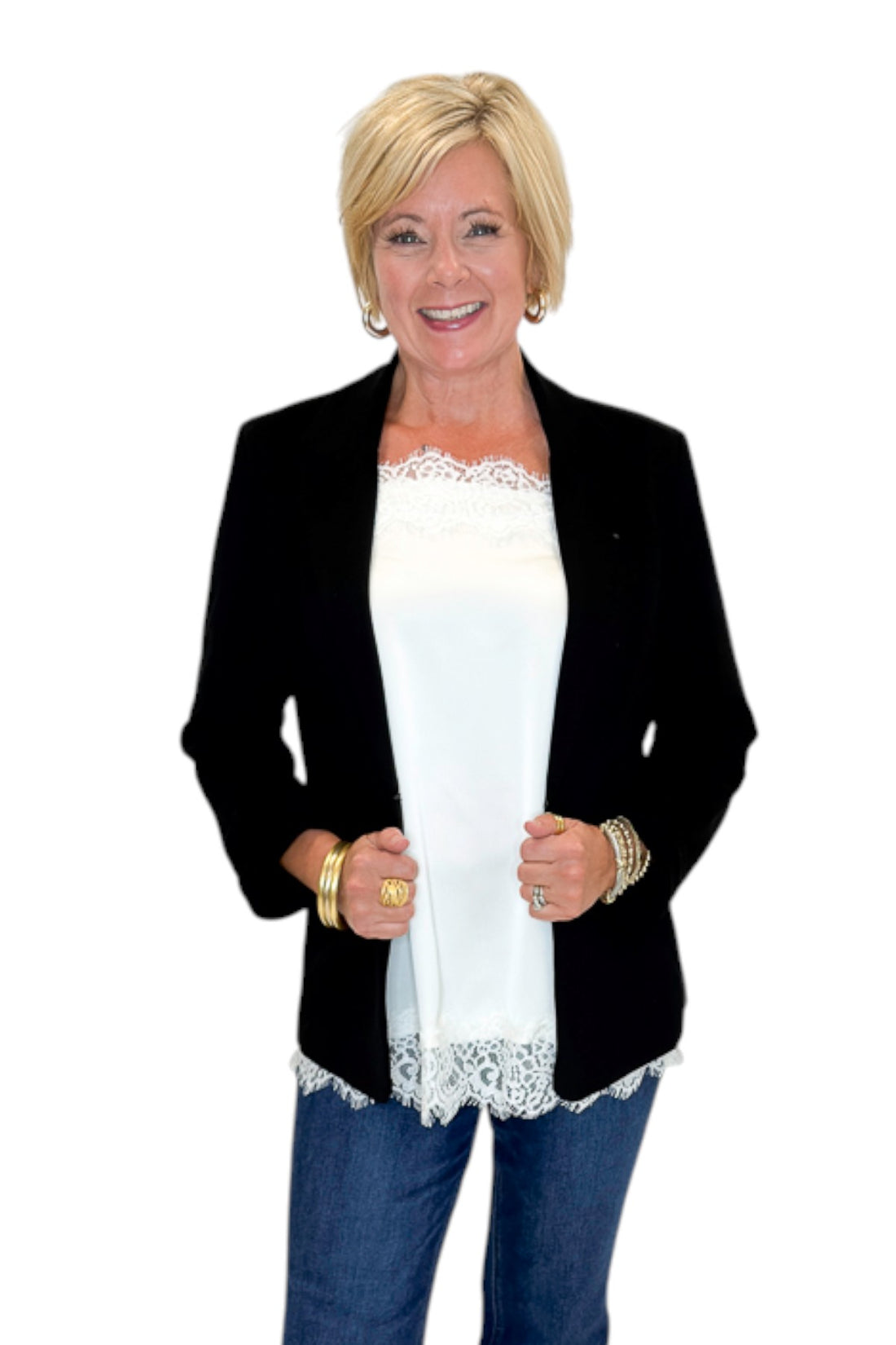 Front view of woman wearing Swagger Boutique’s Black Blazer and Ivory Satin Lace Trim Tank Top by Entro with jeans against white studio background.