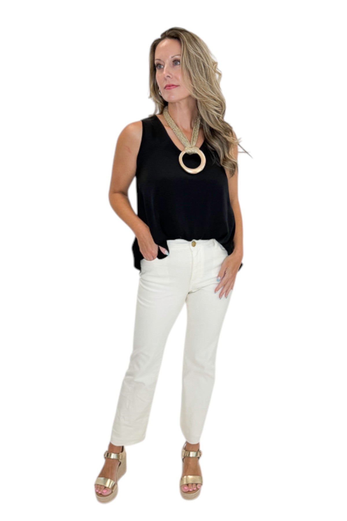 Front view of woman wearing Swagger Boutique’s Black Bubble Hem Tank with jeans against white studio background.