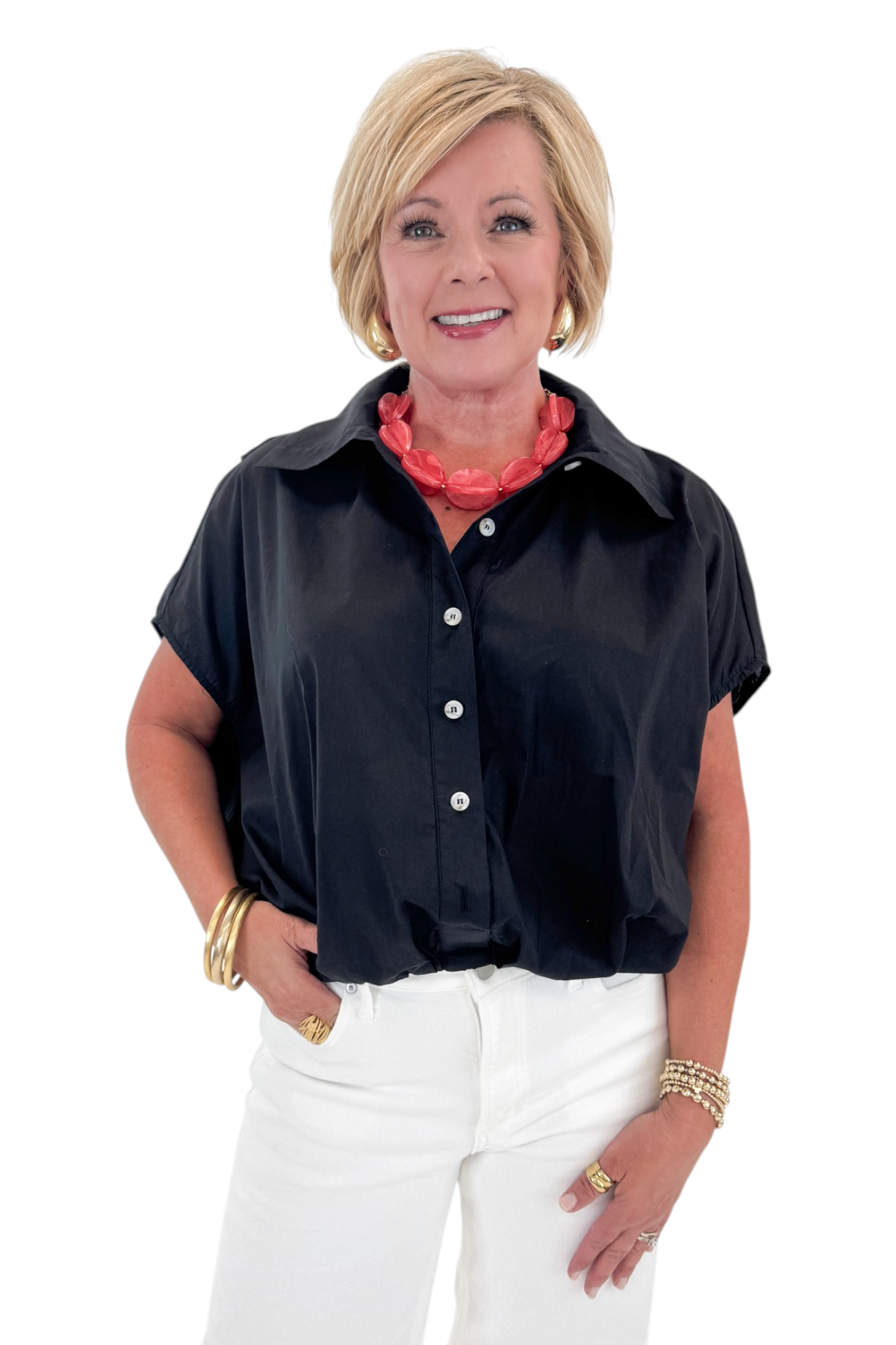 Front view of woman wearing Swagger Boutique’s Black Collared Bubble Hem Top with jeans against white studio background.