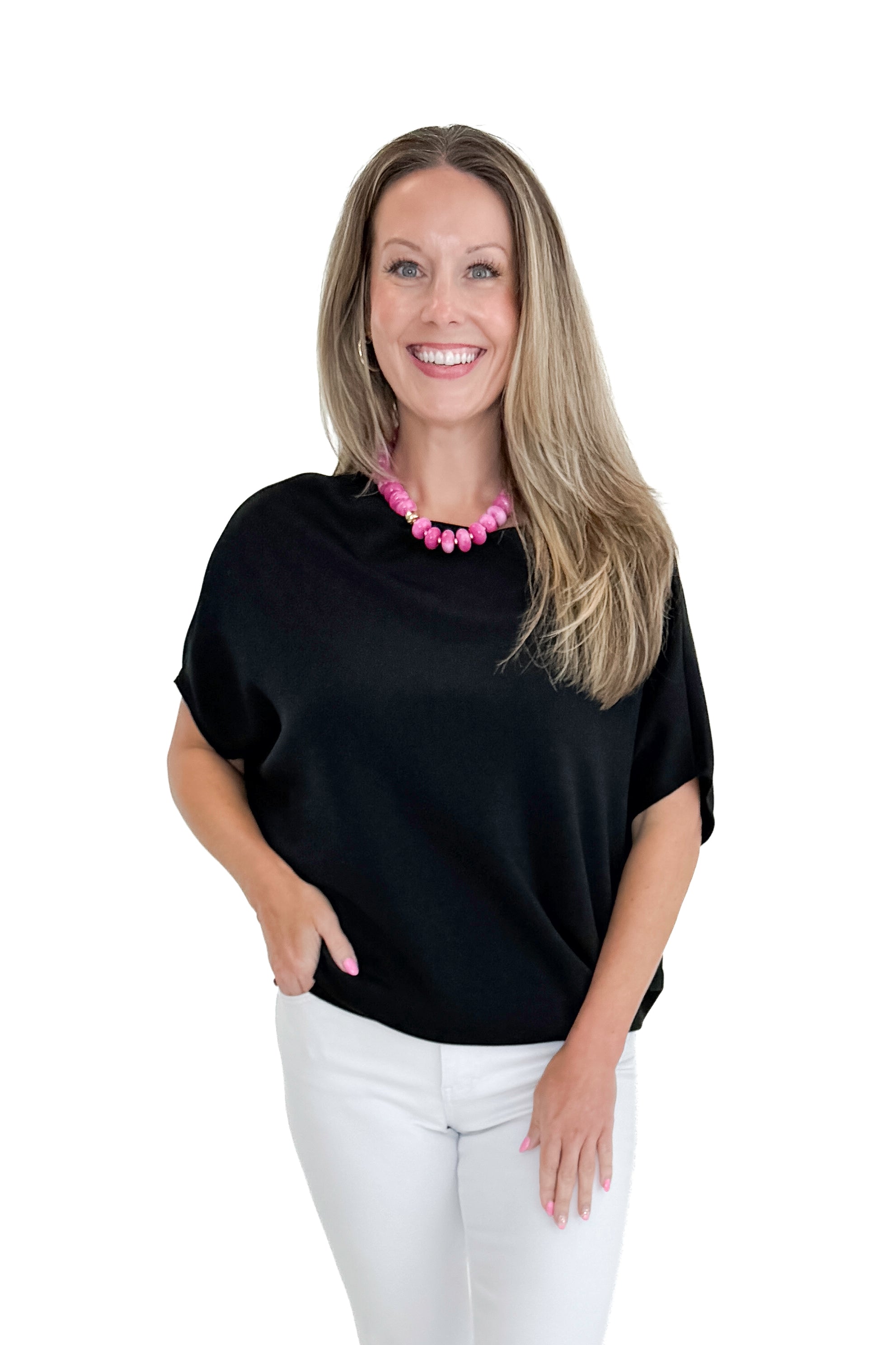 Front view of woman wearing Swagger Boutique’s Black Dolman Sleeve Top with jeans against white studio background.