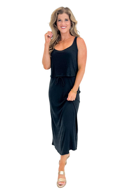 Front view of woman wearing Swagger Boutique’s Black Joanna Tank by Z Supply with Black Idris Maxi Skirt by Z Supply against white studio background.