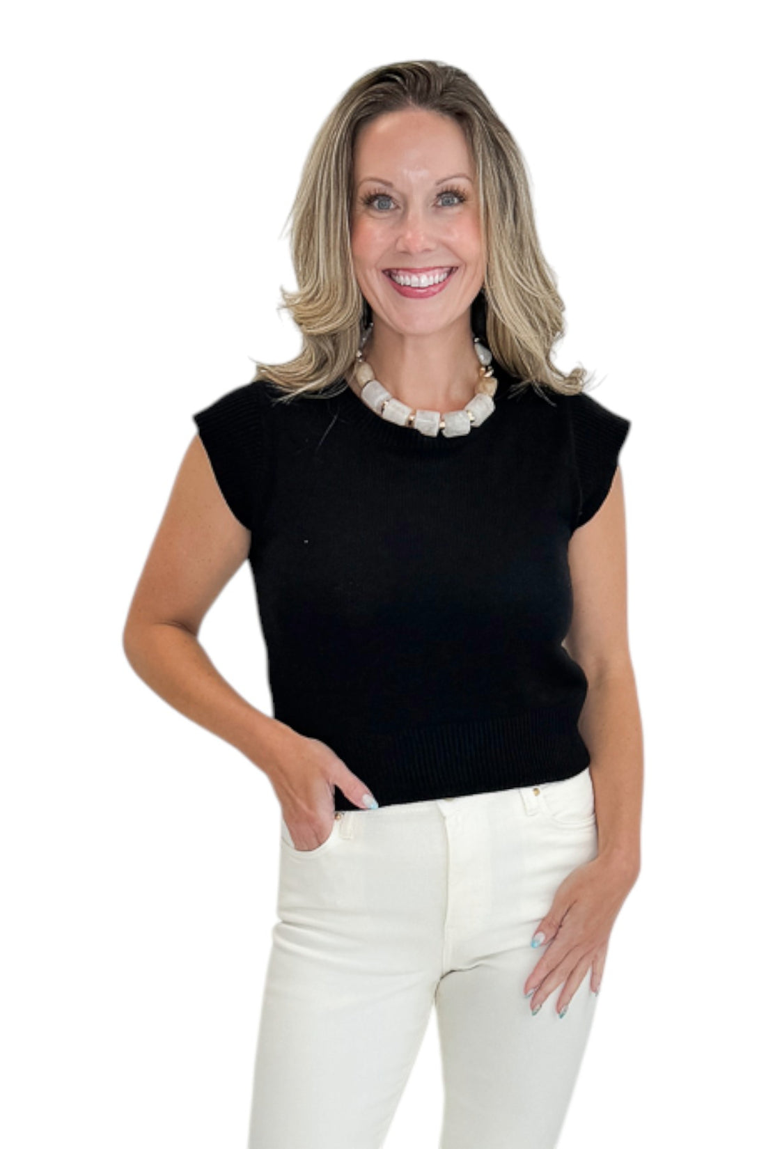 Front view of woman wearing Swagger Boutique’s Black Cap Sleeve Sweater with jeans against white studio background.