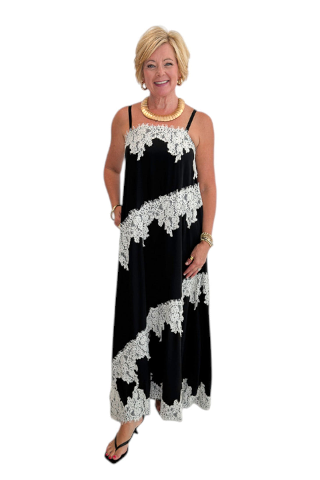 Front view of woman wearing Swagger Boutique’s Black &amp; Cream Lace Trim Maxi Dress against white studio background.