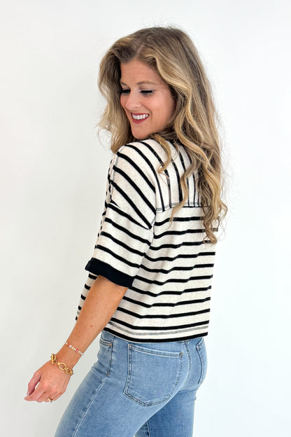 Side view of woman wearing Swagger Boutique&