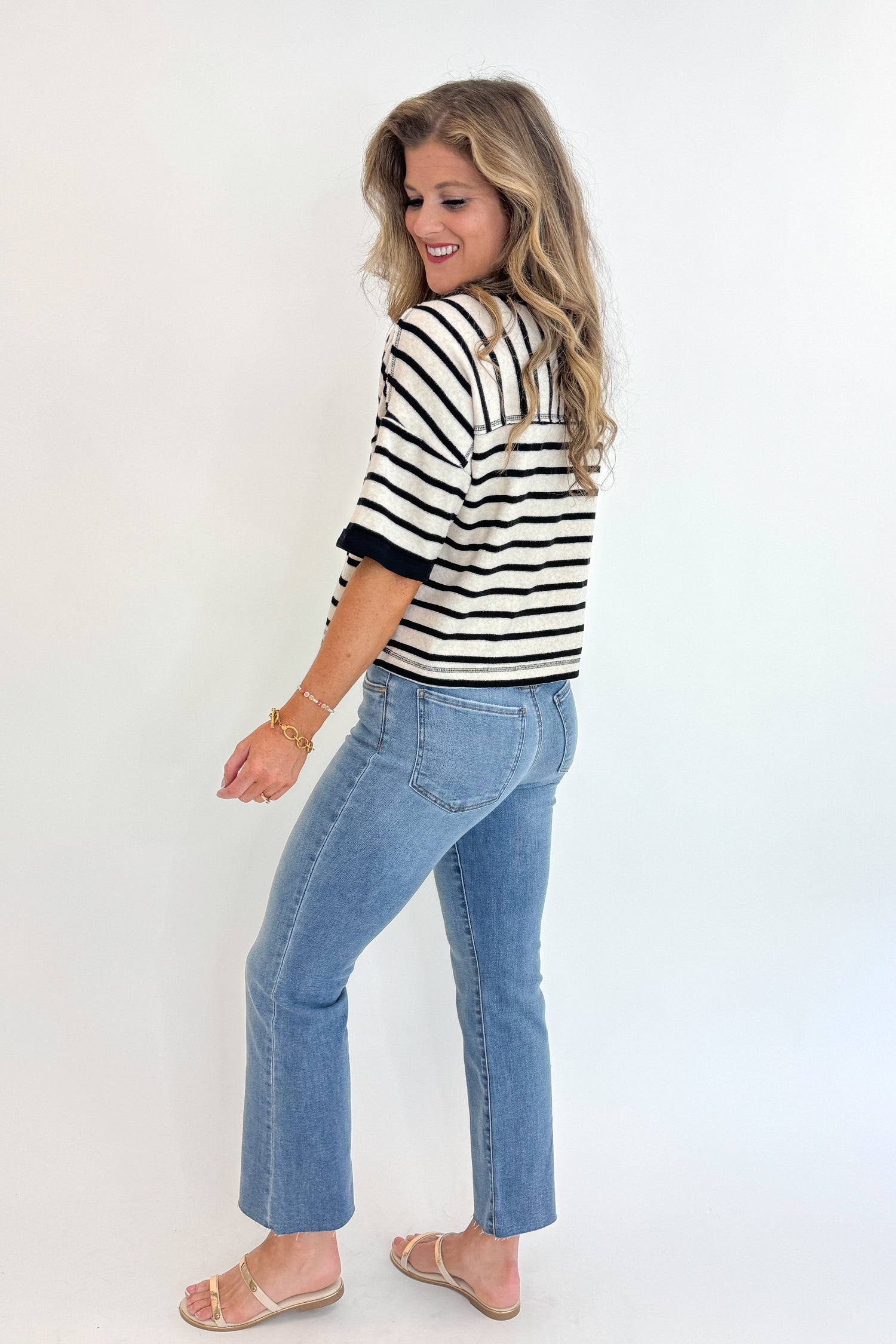 Side view of woman wearing Swagger Boutique&