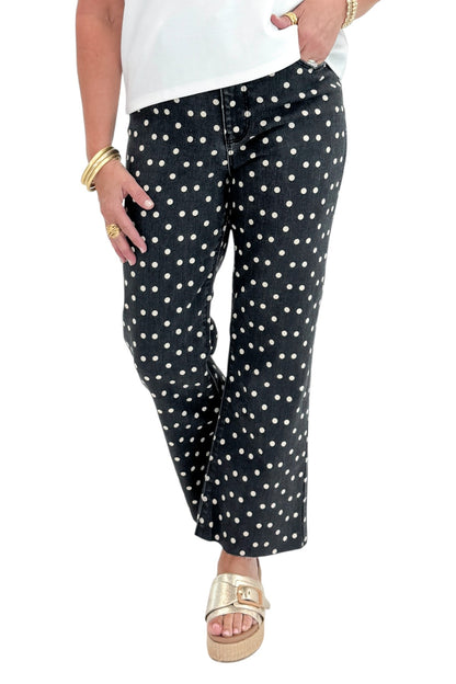 Front view of woman wearing Swagger Boutique’s Black &amp; White Polka Dot Crop Flare Jeans by Just Black Denim with top against white studio background.