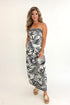 Front view of woman wearing Swagger Boutique’s Black & White Tropical Print Strapless Top with matching Black & White Tropical Print Pants against white studio background.