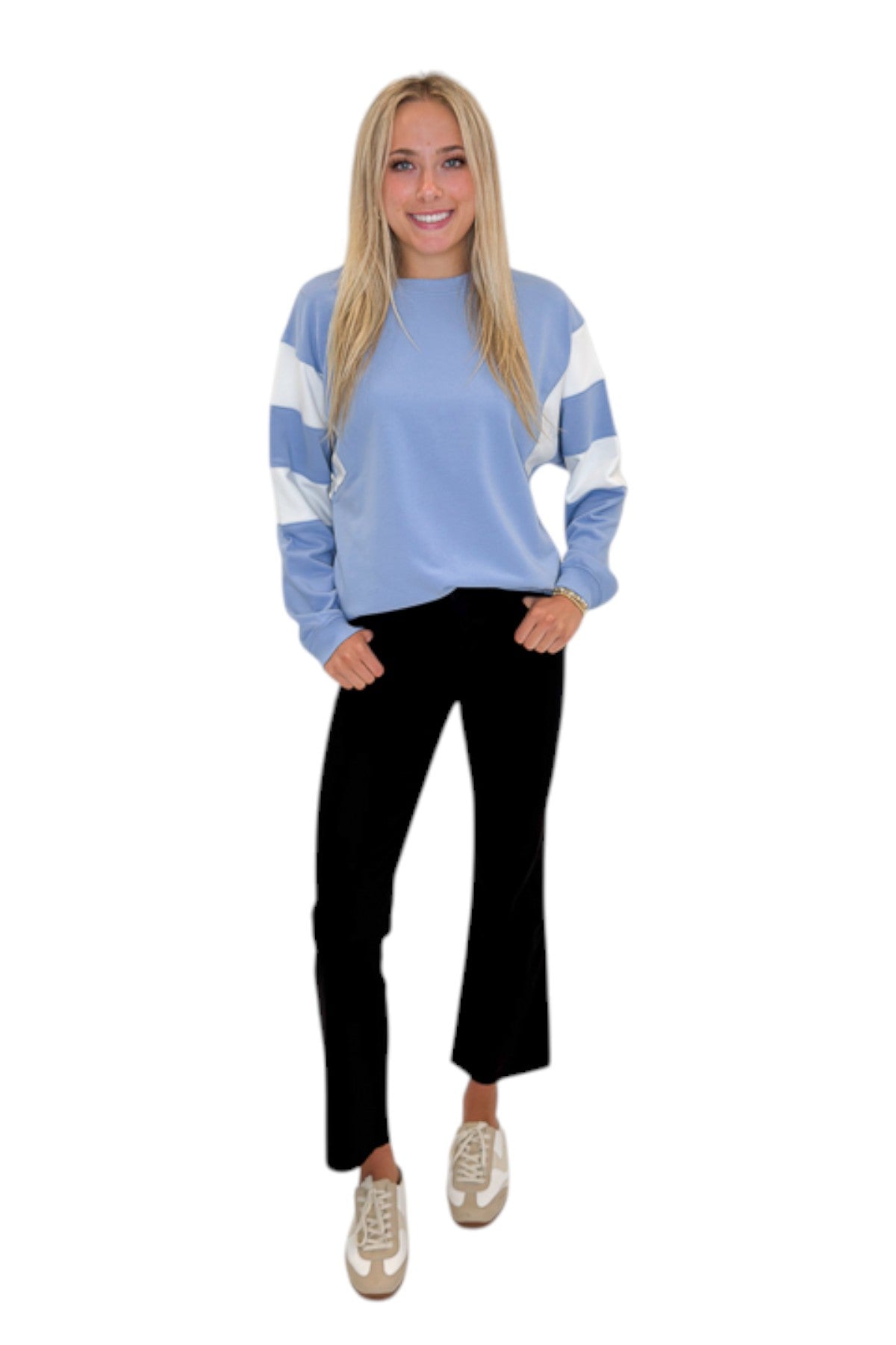 Front view of woman wearing Swagger Boutique’s Blue Color Blocked Long Sleeve Top with jeans against white studio background.