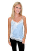 Front view of woman wearing Swagger Boutique’s Blue Satin Lace Lined Tank with jeans against white studio background.