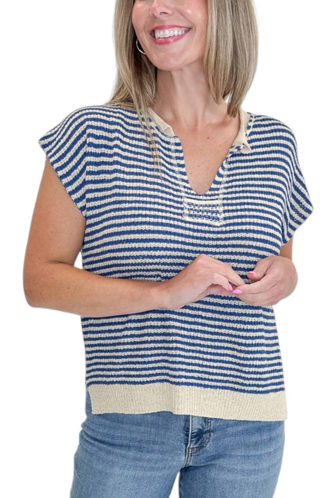 Front detail view of woman wearing Swagger Boutique’s Blue &amp; Beige Striped Sleeveless Sweater with jeans against white studio background.