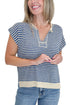 Front detail view of woman wearing Swagger Boutique’s Blue & Beige Striped Sleeveless Sweater with jeans against white studio background.