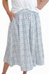 Front view of woman wearing Swagger Boutique’s Blue & Brown Abstract Print  skirt against white studio background.