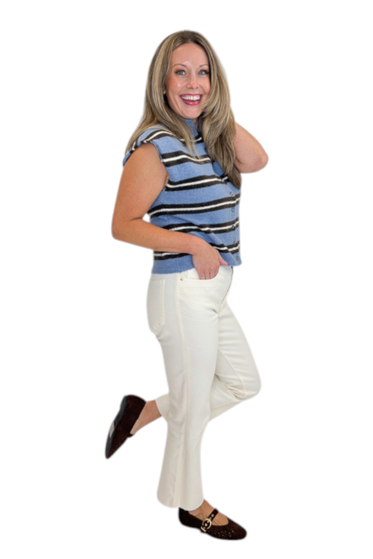 Side view of woman wearing Swagger Boutique’s Blue &amp; Brown Striped Sleeveless Sweater by Entro with jeans against white studio background.