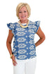Front view of woman wearing Swagger Boutique’s Blue & Cream Embroidered Top with jeans against white studio background.