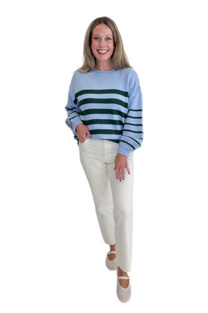 Front view of woman wearing Swagger Boutique’s Blue &amp; Green Striped Sweater with jeans against white studio background.