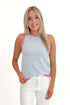 Front view of woman wearing Blue & Lilac Striped Sweater Tank with jeans against white studio background.