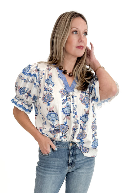Front view of woman wearing Blue &amp; Multi Printed Lace Detail Top with jeans against white studio background.