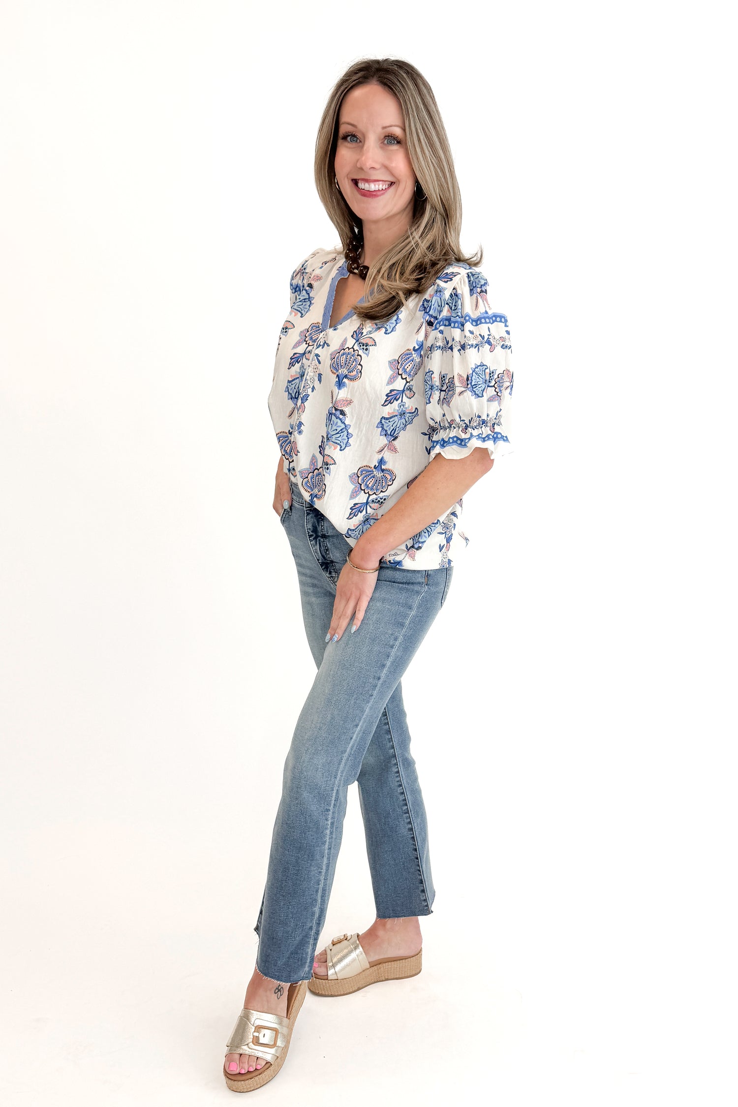 Front view of woman wearing Blue &amp; Multi Printed Lace Detail Top with jeans against white studio background.