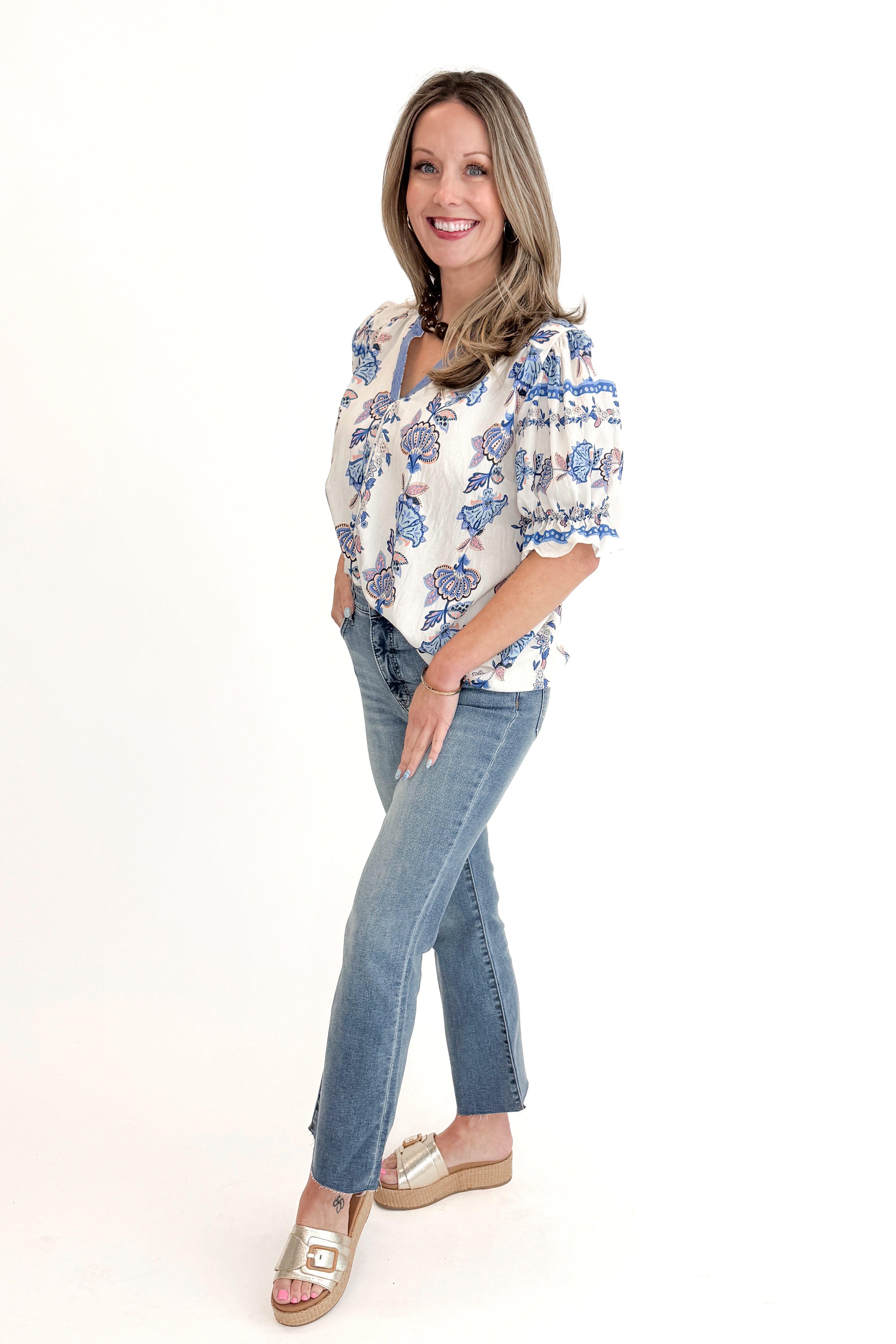 Front view of woman wearing Blue &amp; Multi Printed Lace Detail Top with jeans against white studio background.