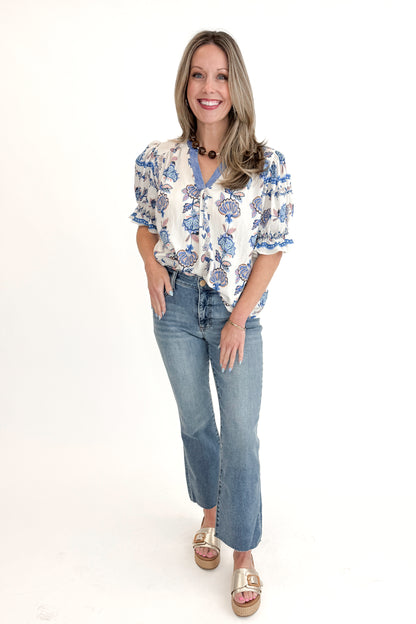 Front view of woman wearing Blue &amp; Multi Printed Lace Detail Top with jeans against white studio background.