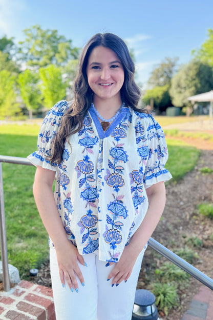 Front view of woman wearing Blue &amp; Multi Printed Lace Detail Top with jeans outside at a park.