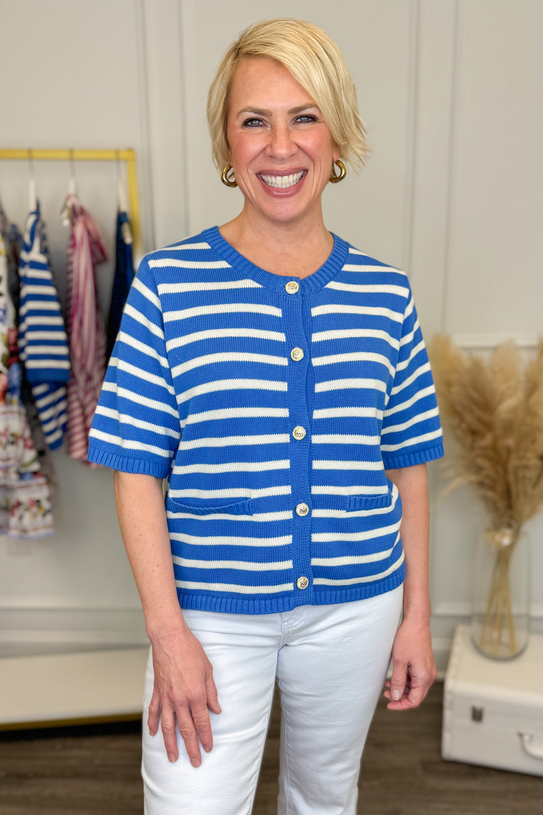 Front view of woman wearing Blue Striped Button Up Short Sleeve Sweater with jeans at Swagger Boutique.