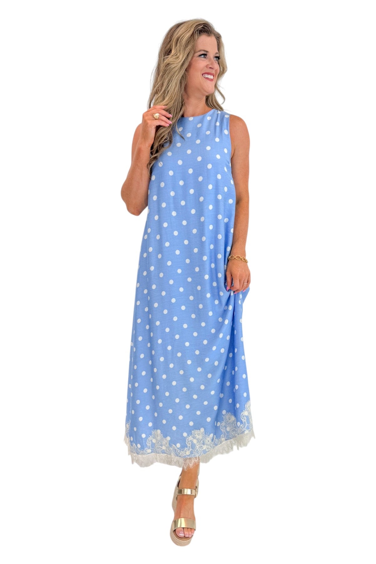 Front view of woman wearing Swagger Boutique’s Blue &amp; White Polka Dot Lace Trim Maxi Dress by Entro with wedges against white studio background.