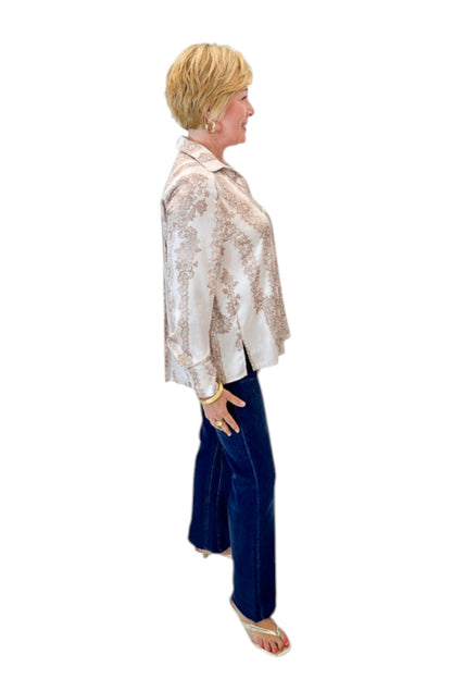 Side view of woman wearing Swagger Boutique’s Blush &amp; Tan Lace Print Button Up Top with jeans against white studio background.