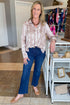 Front view of woman wearing Swagger Boutique’s Blush & Tan Lace Print Button Up Top with jeans standing at the store.