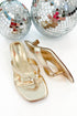 Brat- Gold Thong Kitten Heels against white studio background.