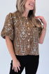 Front detail view of woman wearing Swagger Boutique’s Brown Floral Corduroy Top with jeans against white studio background.