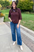 Front view of woman wearing Swagger Boutique’s Brown Lightweight Half Sleeve Sweater with jeans standing outside at a park.