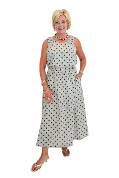 Front view of woman wearing Swagger Boutique’s Brown Polka Dot Bubble Hem Tank and Midi Skirt by Entro against white studio background.