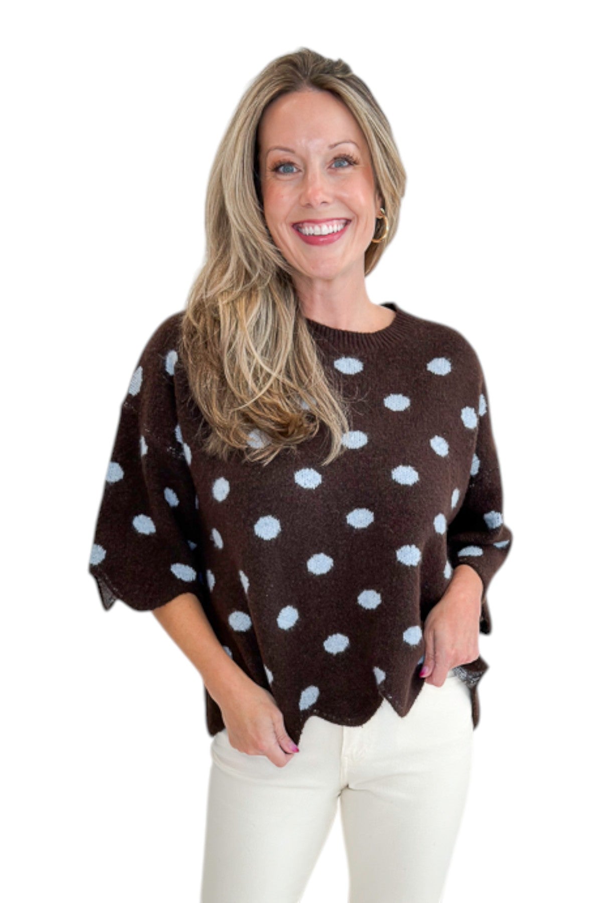 Front view of woman wearing Swagger Boutique’s Brown Polka Dot Short Sleeve Sweater by Entro with jeans against white studio background.