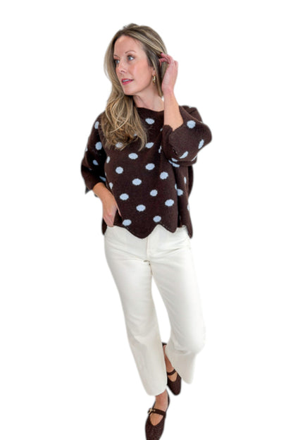 Front view of woman wearing Swagger Boutique’s Brown Polka Dot Short Sleeve Sweater by Entro with jeans against white studio background.