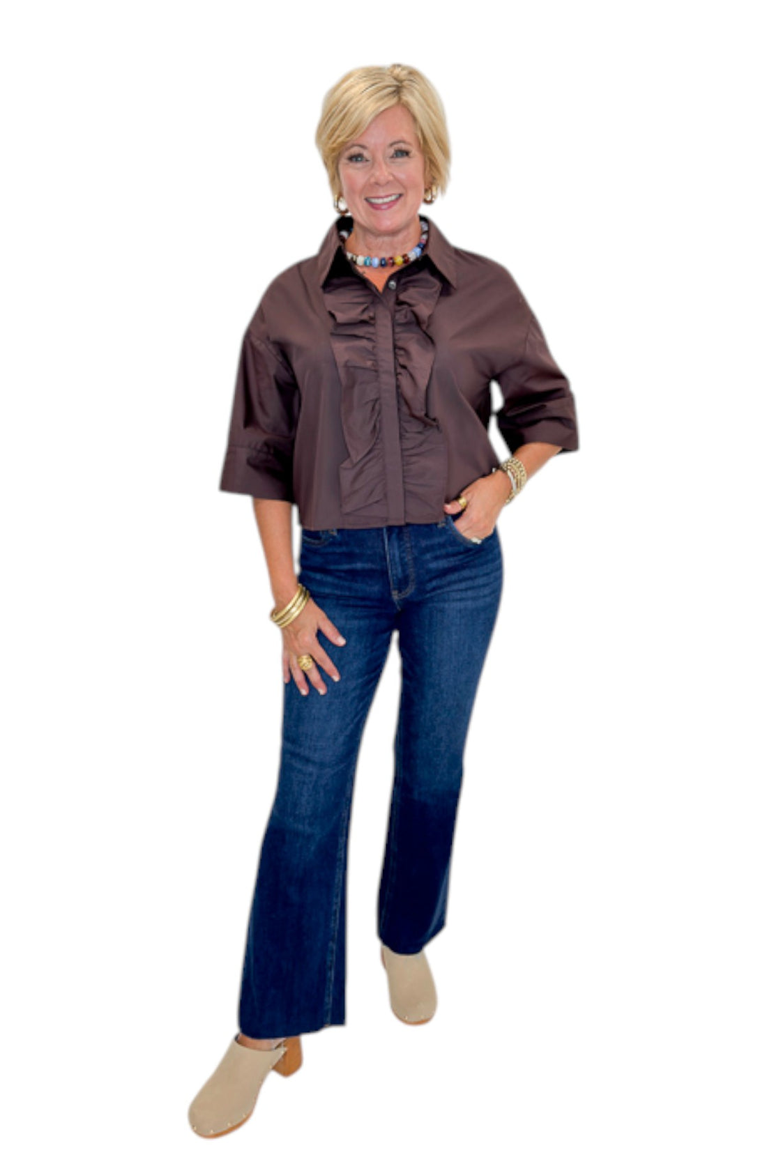 Front view of woman wearing Swagger Boutique’s Brown Ruffle Trim 3/4 Sleeve Top by Entro with jeans against white studio background.