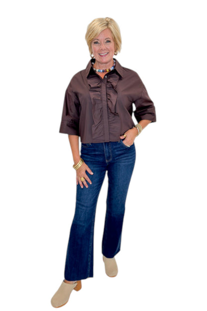 Front view of woman wearing Swagger Boutique’s Brown Ruffle Trim 3/4 Sleeve Top by Entro with jeans against white studio background.