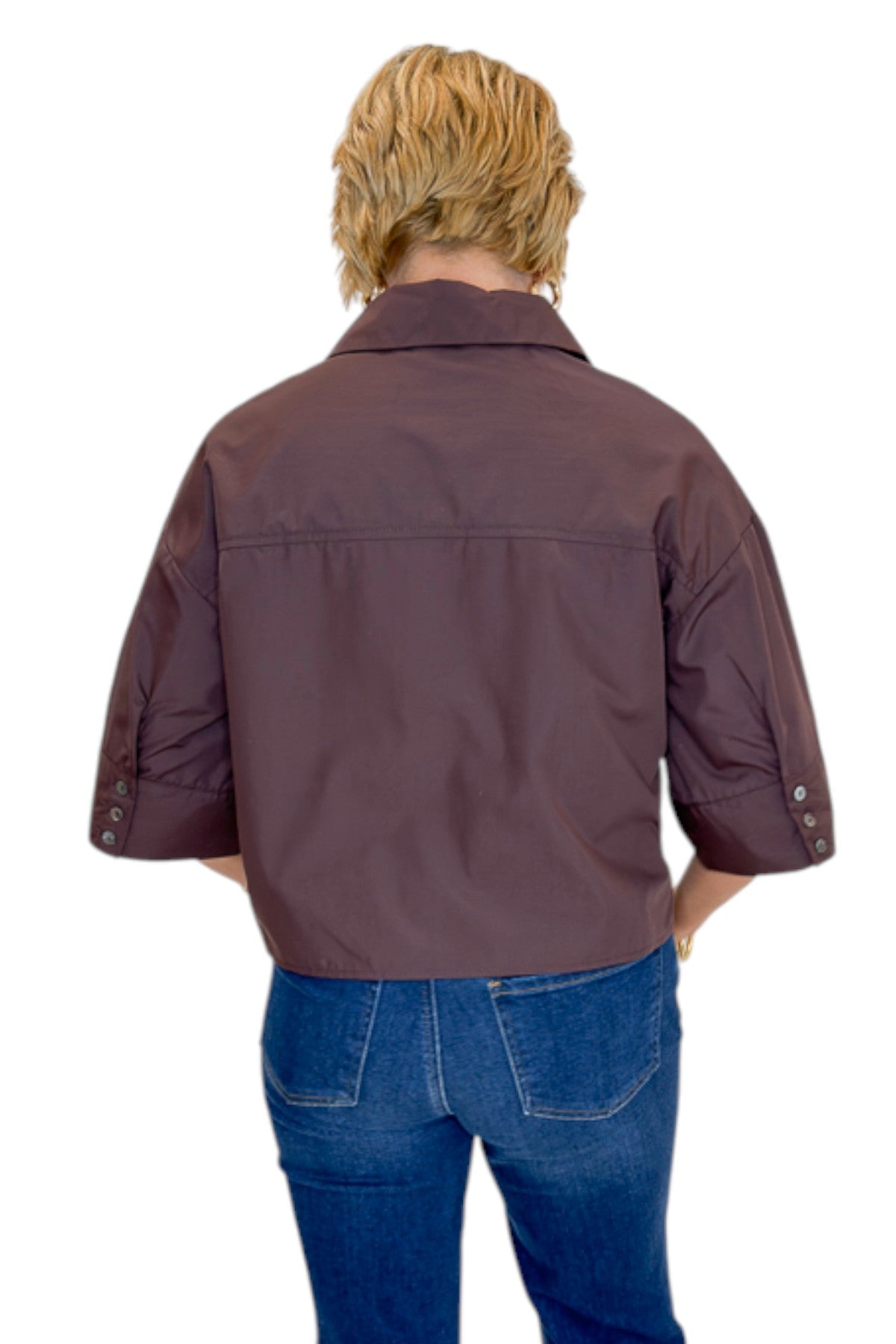 Back view of woman wearing Swagger Boutique’s Brown Ruffle Trim 3/4 Sleeve Top by Entro with jeans against white studio background.