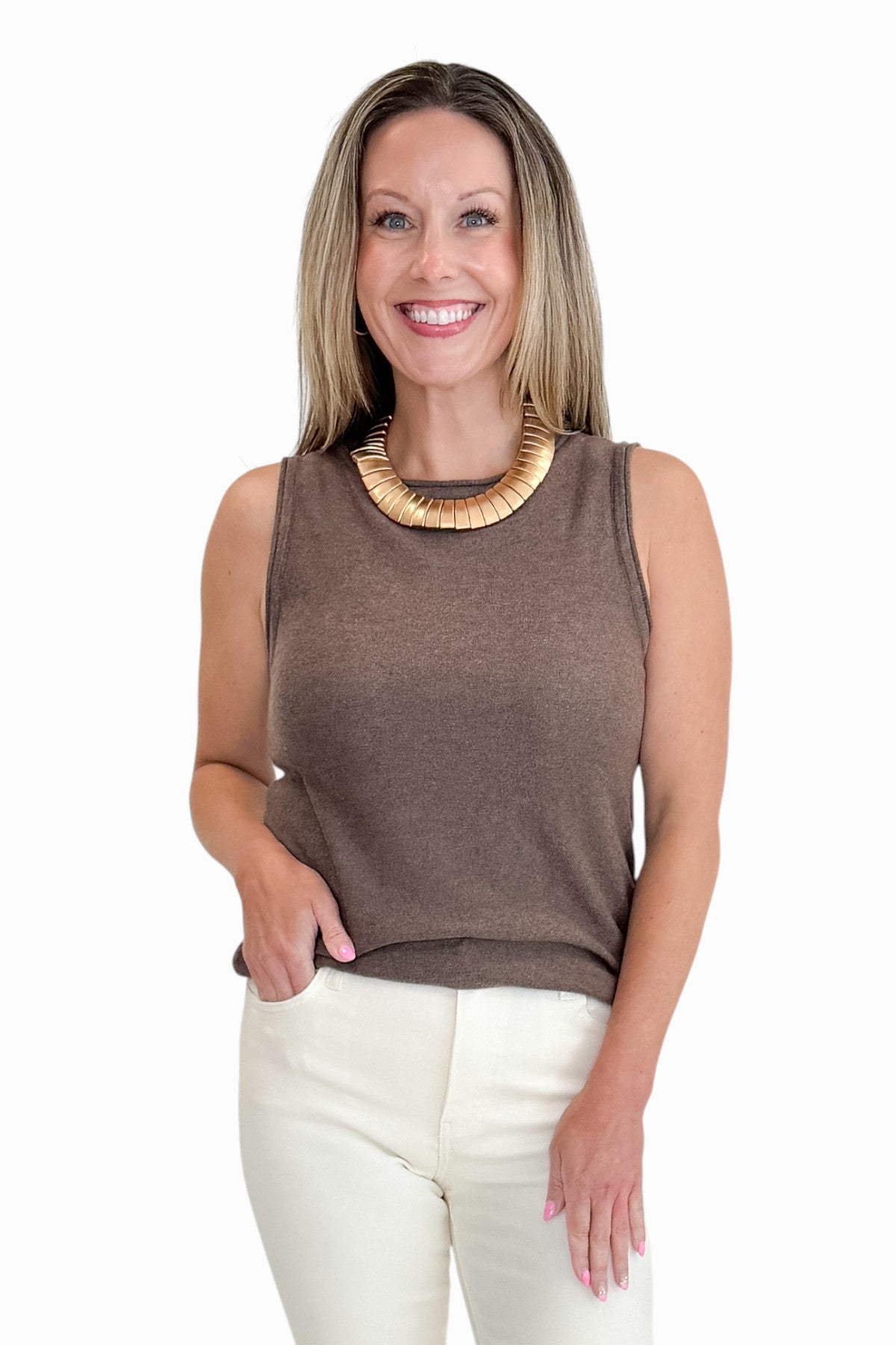 Front view of woman wearing Swagger Boutique’s Brown Sweater Tank with jeans against white studio background.