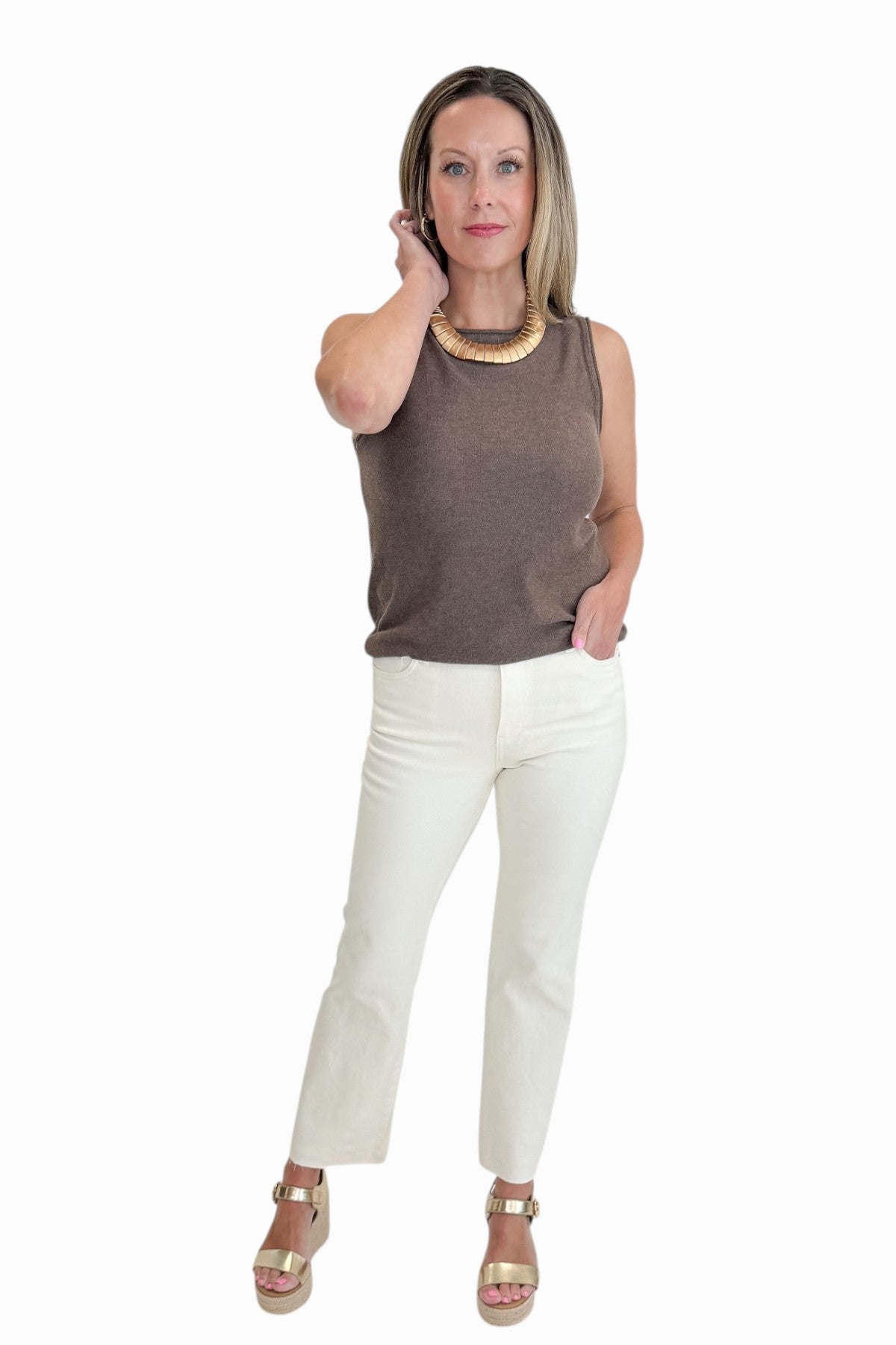 Front view of woman wearing Swagger Boutique’s Brown Sweater Tank with Ecru jeans against white studio background.