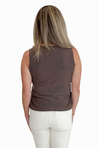 Back view of woman wearing Swagger Boutique’s Brown Sweater Tank with jeans against white studio background.