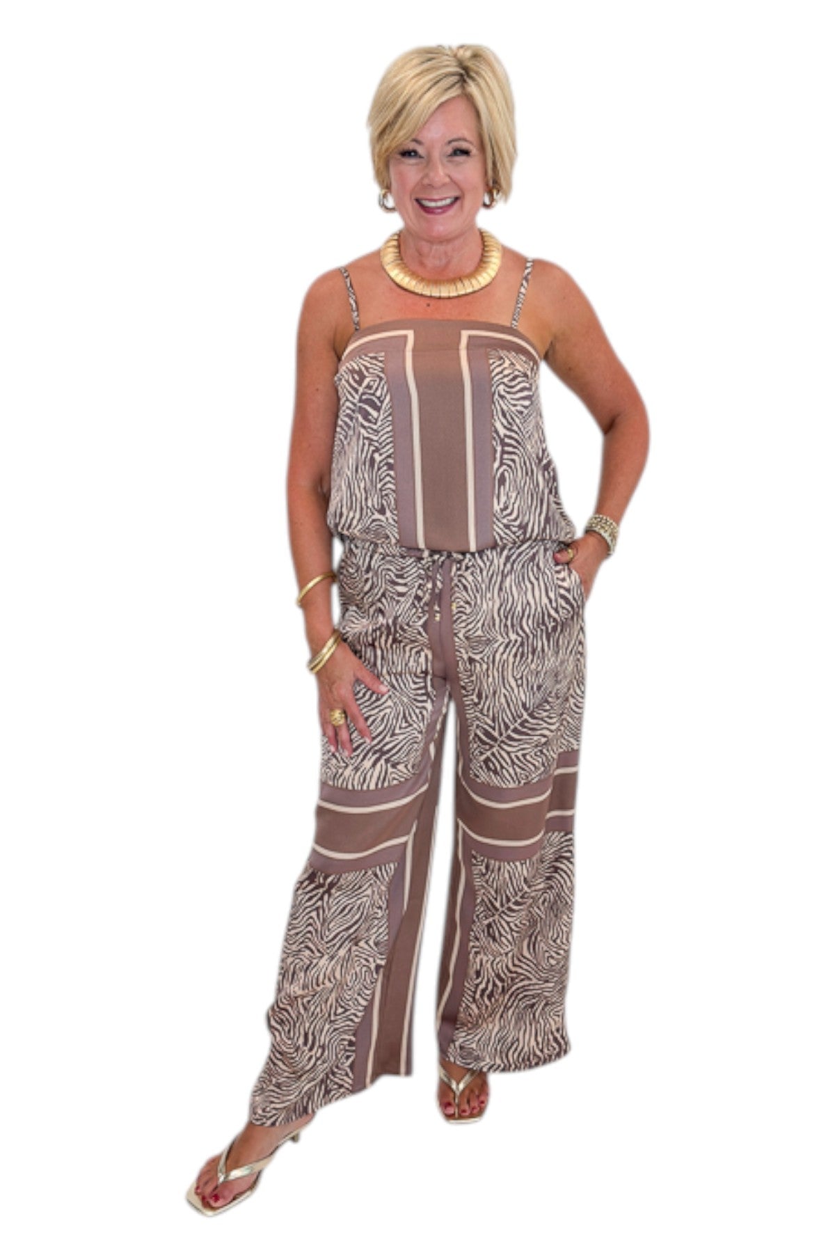 Front view of woman wearing Swagger Boutique’s Brown Zebra Tank by Entro with Wide Leg Pants against white studio background.
