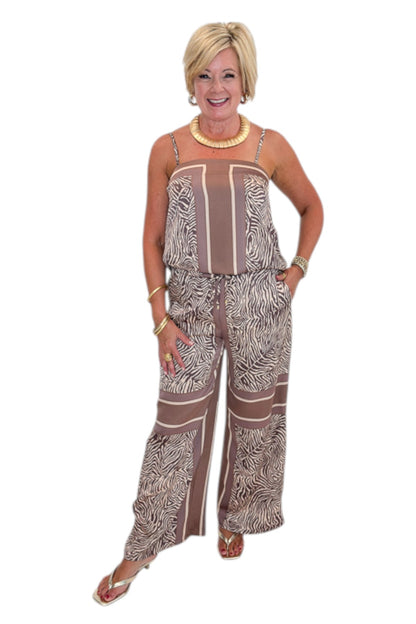 Front view of woman wearing Swagger Boutique’s Brown Zebra Tank by Entro with Wide Leg Pants against white studio background.