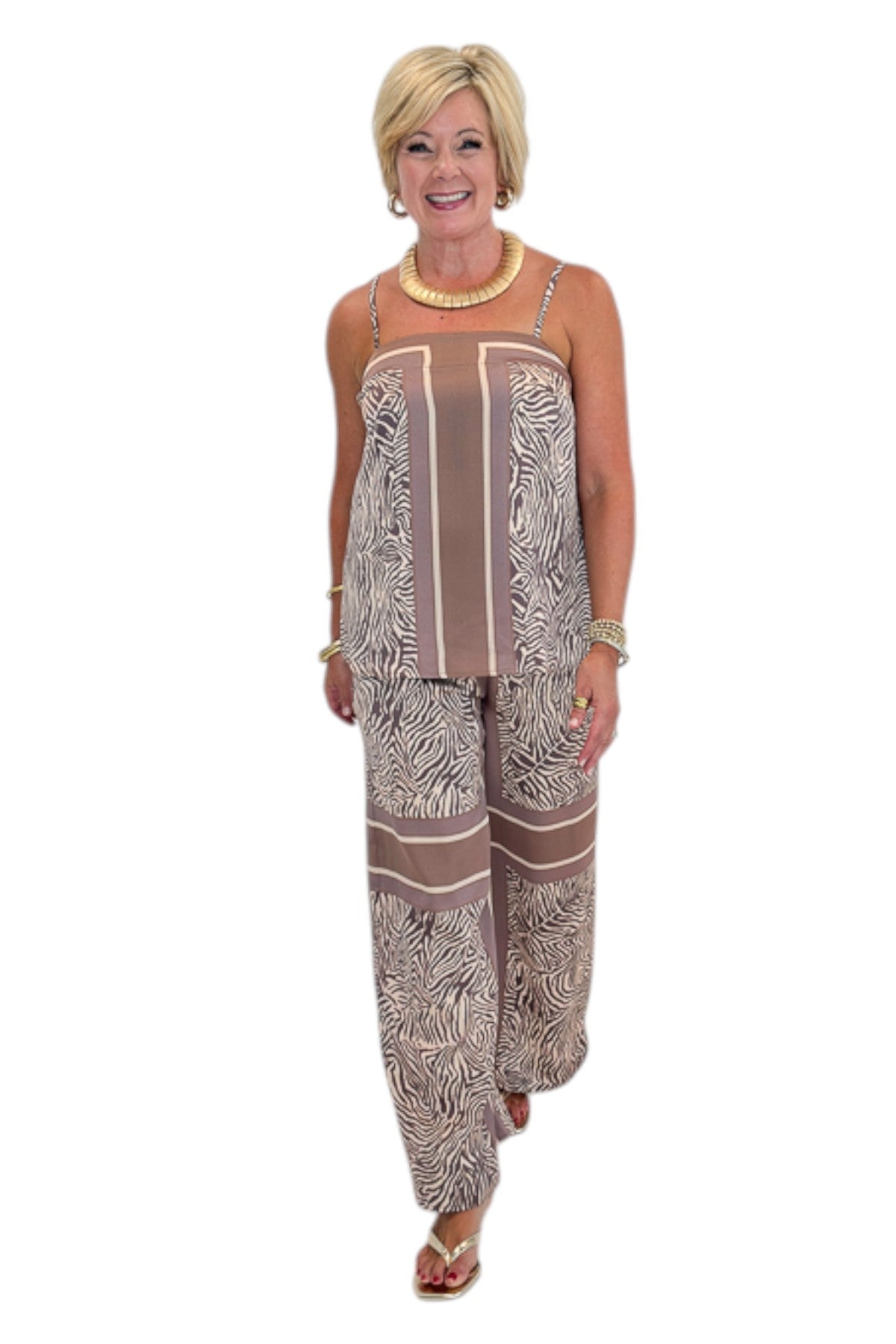Front view of woman wearing Swagger Boutique’s Brown Zebra Tank by Entro with Wide Leg Pants against white studio background.