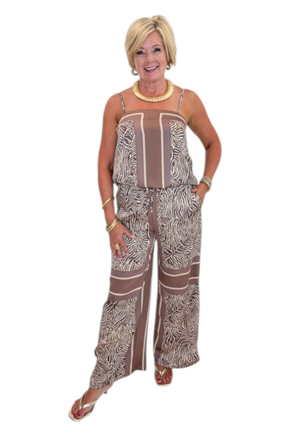 Front view of woman wearing Swagger Boutique’s Brown Zebra Tank by Entro with Wide Leg Pants against white studio background.
