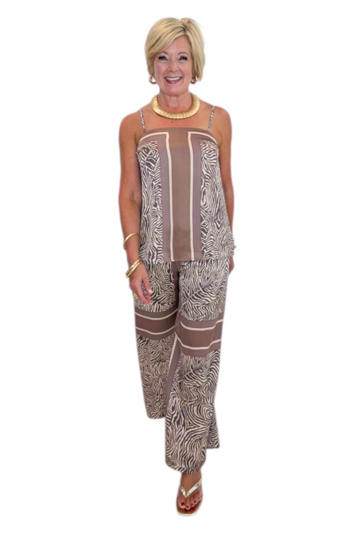 Front view of woman wearing Swagger Boutique’s Brown Zebra Tank by Entro with Wide Leg Pants against white studio background.
