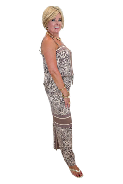 Side view of woman wearing Swagger Boutique’s Brown Zebra Tank by Entro with Wide Leg Pants against white studio background.