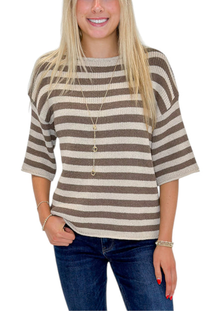 Front detail view of woman wearing Swagger Boutique’s Brown &amp; Beige Striped Short Sleeve Sweater with jeans against white studio background.