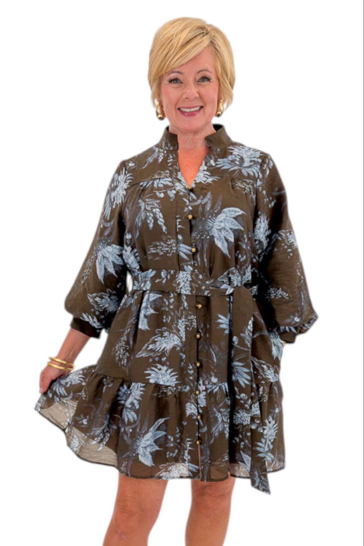 Front view of woman wearing Swagger Boutique’s Brown &amp; Blue Floral Tie Waist Mini Dress against white studio background.