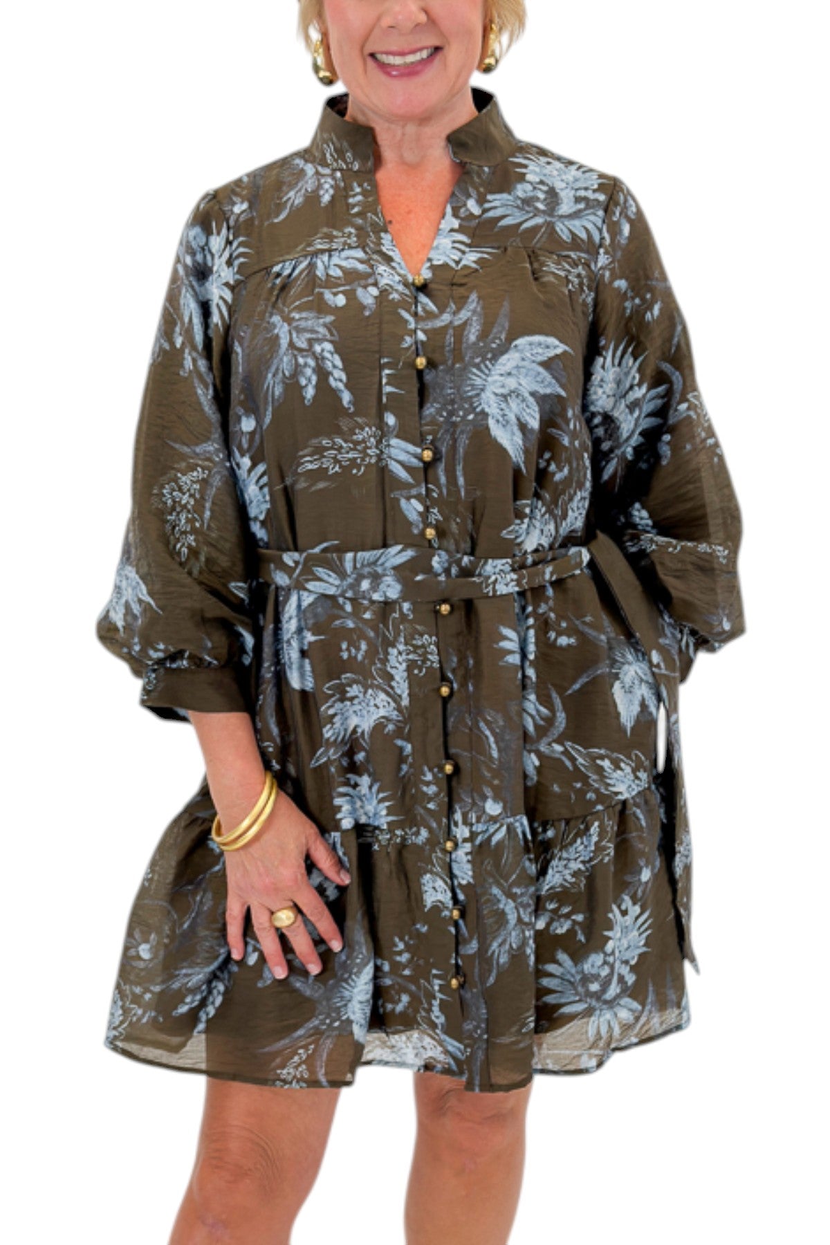 Front detail view of woman wearing Swagger Boutique’s Brown &amp; Blue Floral Tie Waist Mini Dress against white studio background.